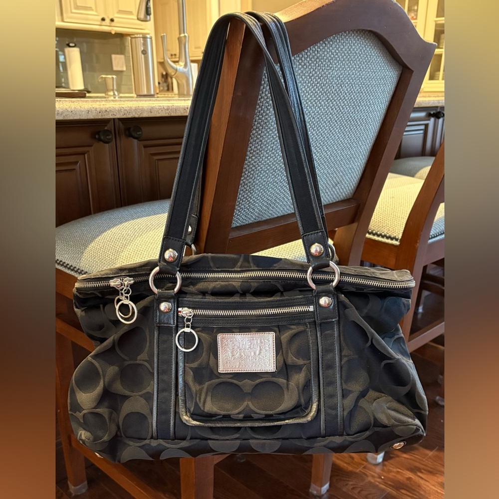 Coach black shoulder bag. Can be used for office or overnight bag.